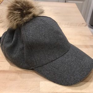 Grey winter ball cap with fur ball